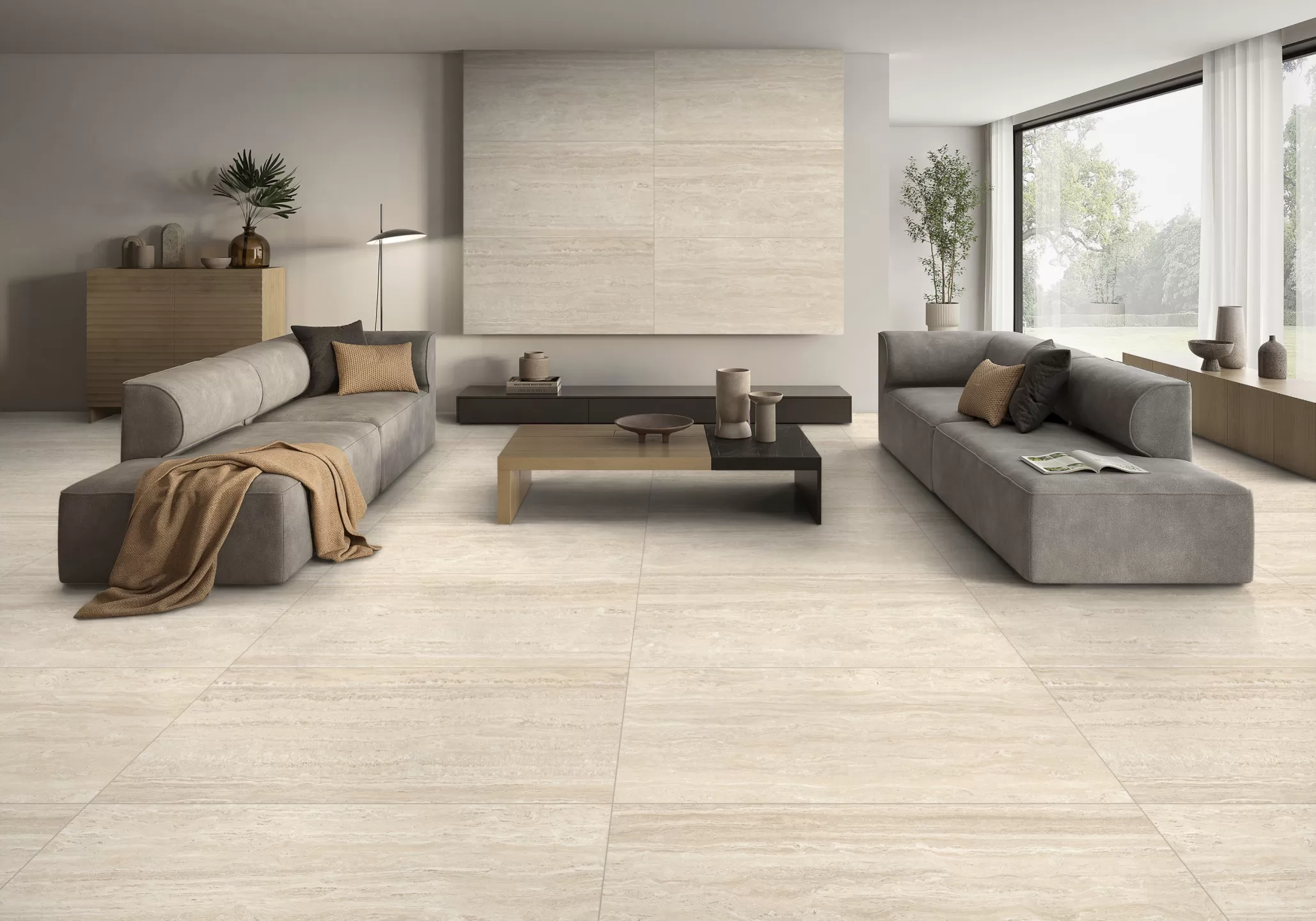 Wide angle view of a modern living room with 600x1200mm travertine look porcelain tiles in beige finish by Armos Tiles